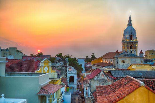 Foggy sunset over the rooftops of the city of Cartagena in Colombia. 