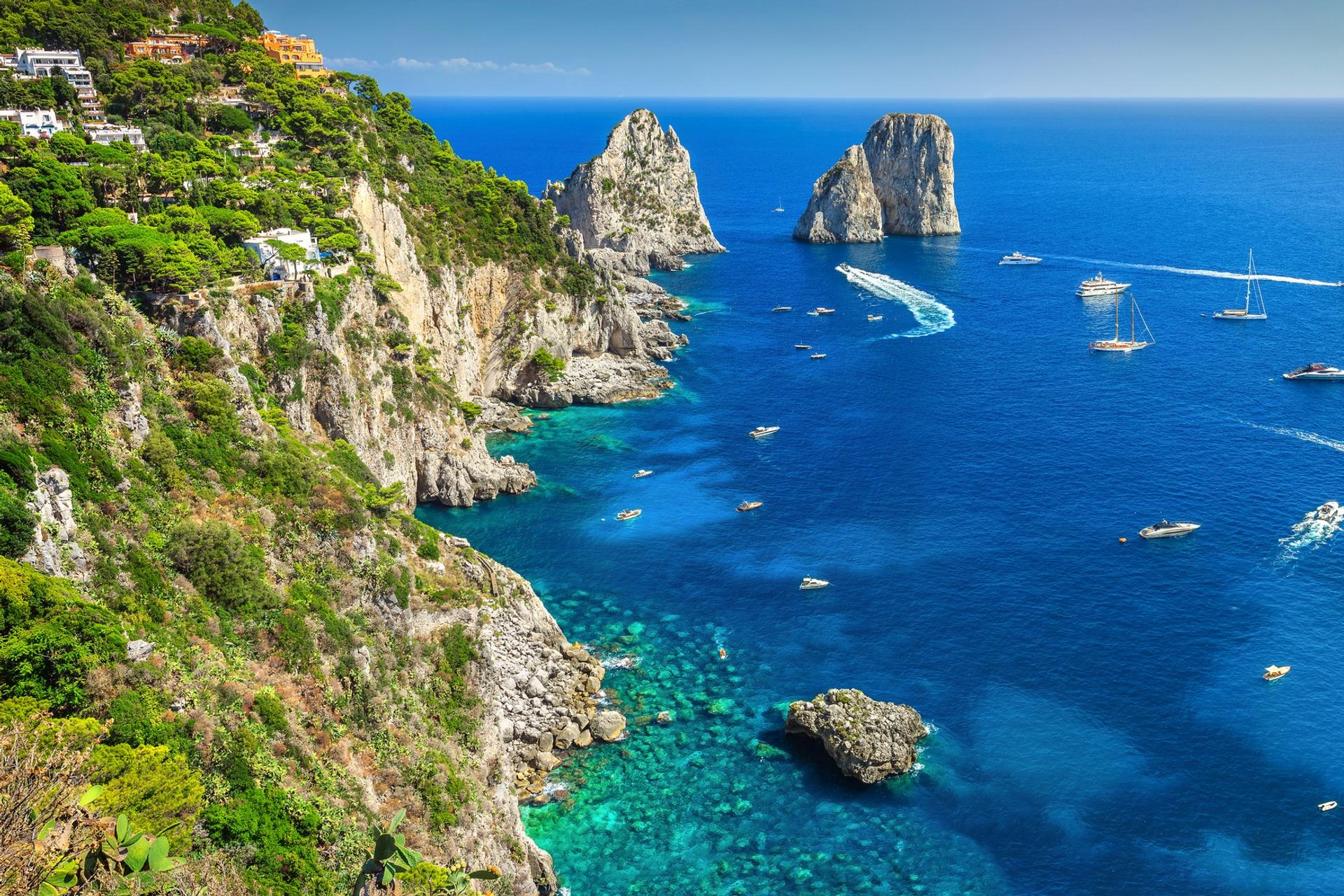 Aerial view of beach in Capri on a sunny day with some clouds