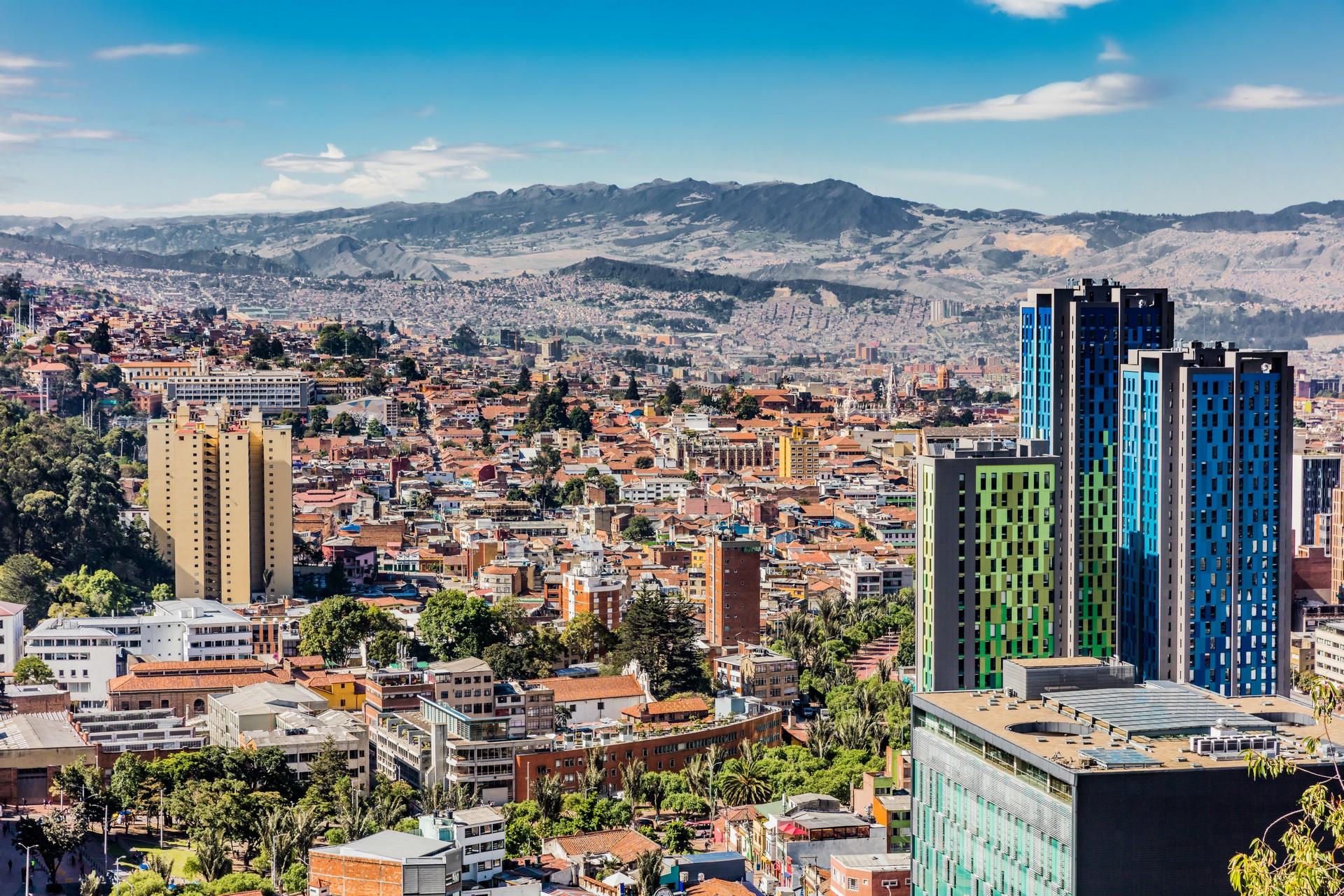 Aerial view of mountain range in Bogota on a sunny day with some clouds