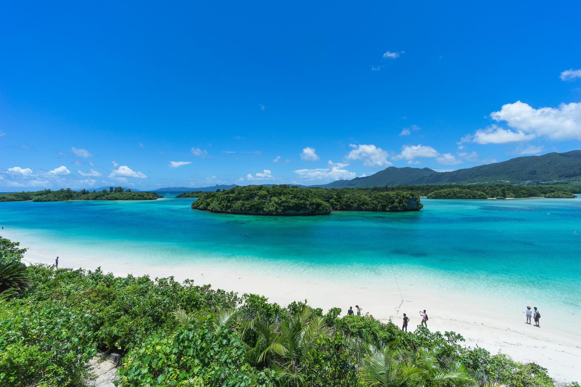 Beach with turquise water in Ishigaki in sunny weather with few clouds