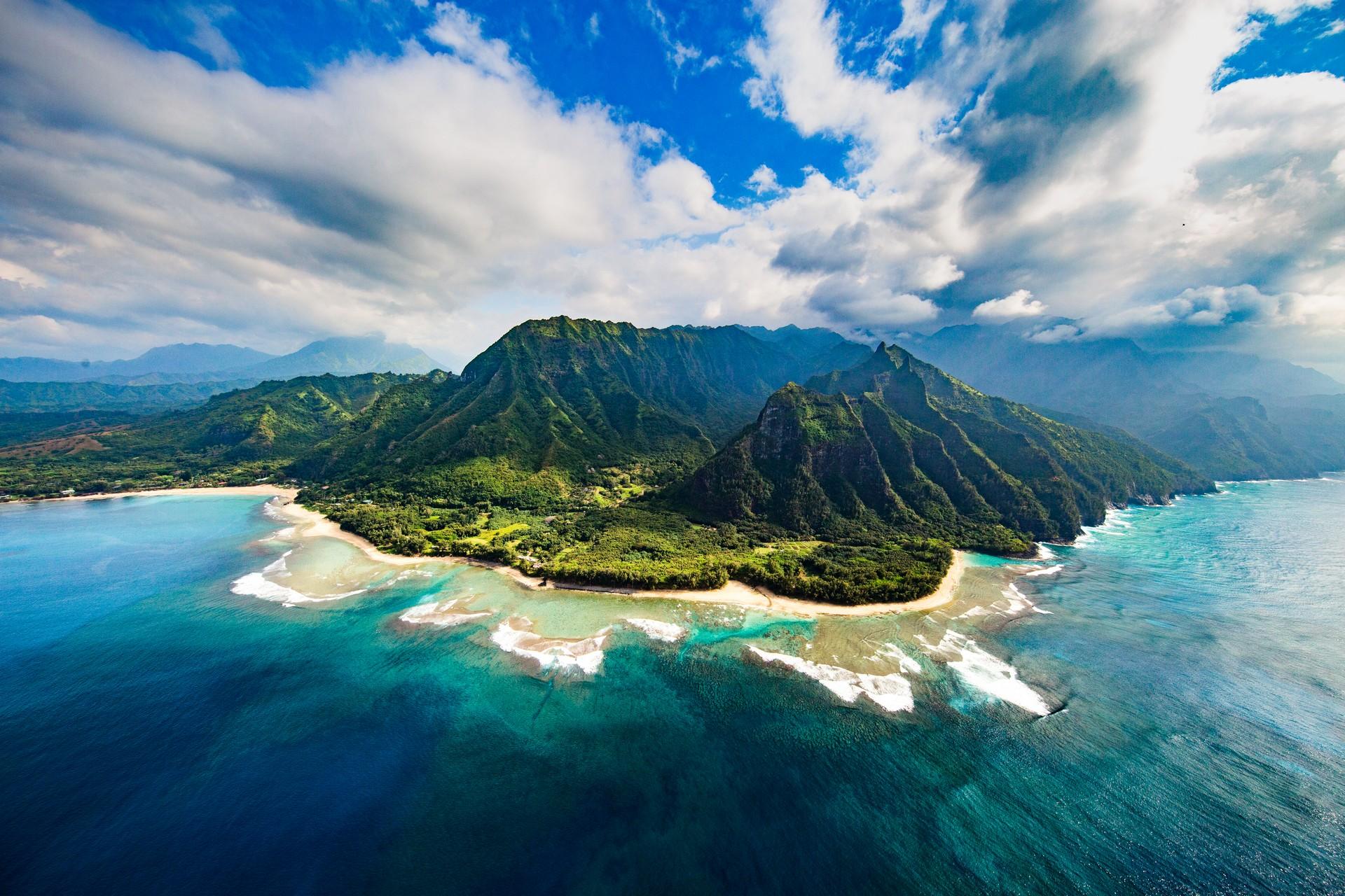 Aerial view of beach in Kauai in partly cloudy weather