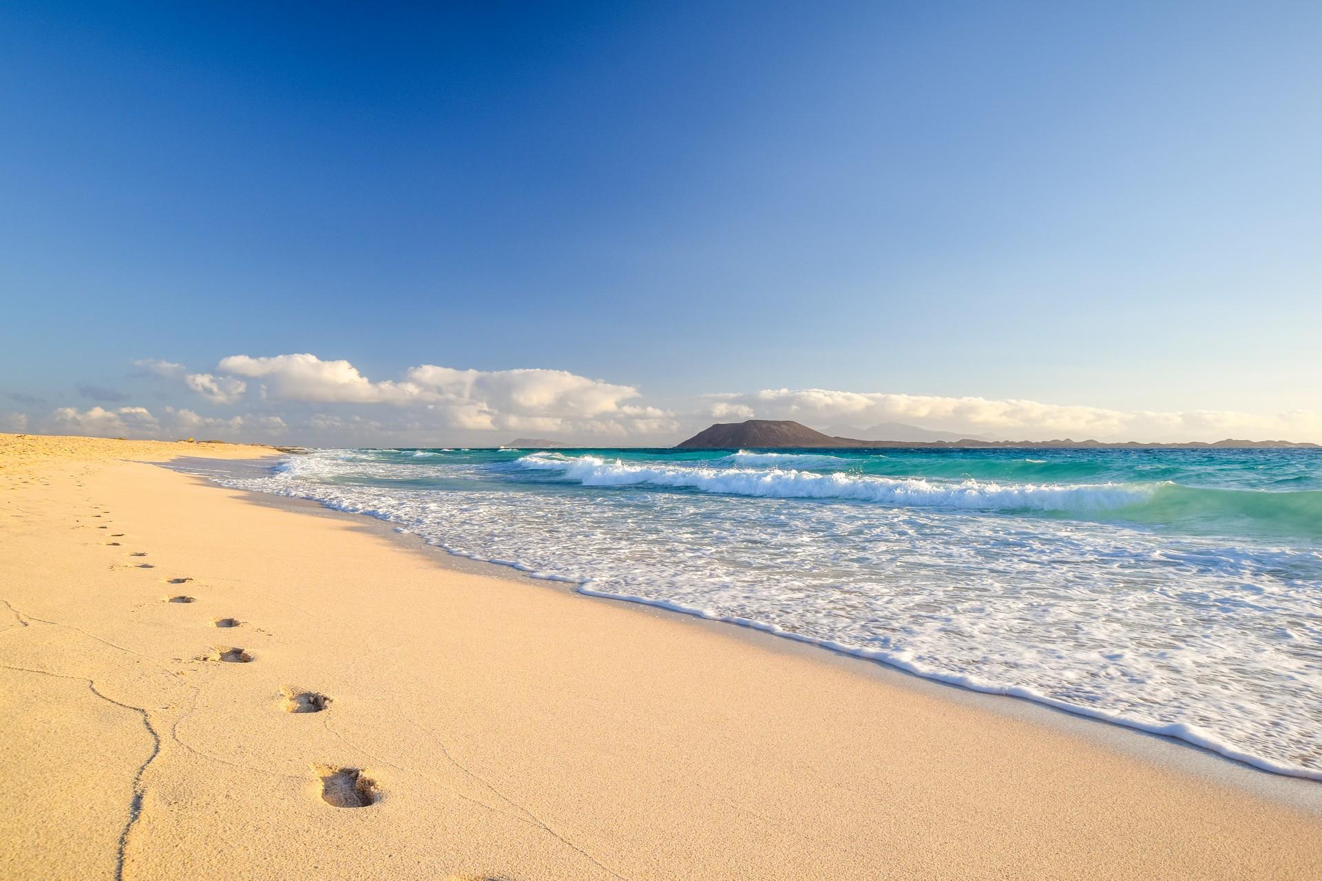 Enjoyable beach in Canary Islands on a sunny day with some clouds