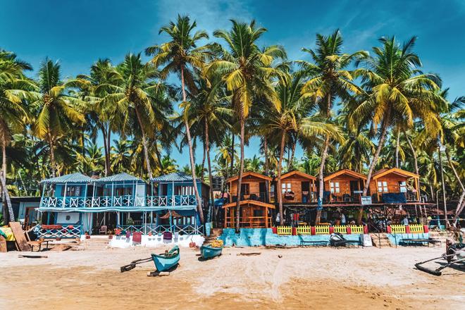 Beach bar and houses on a beach in Goa, India
