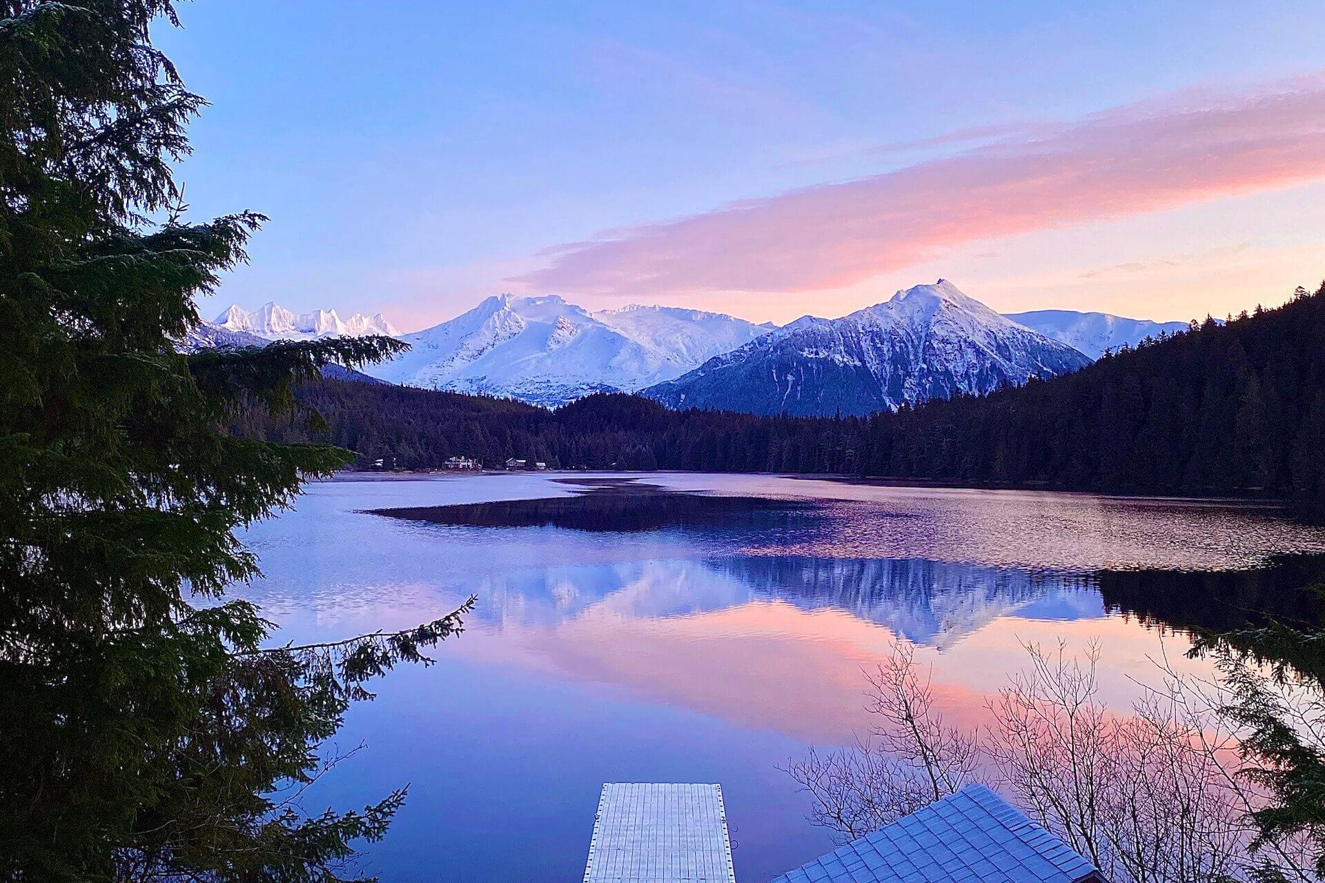 View of the snowy mountains and lake in Alaska