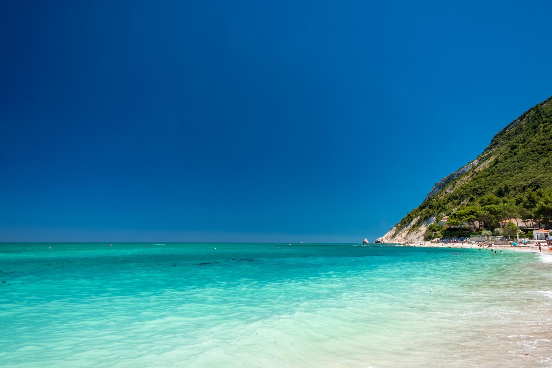 Beach with turquise sea in Numana on a sunny day