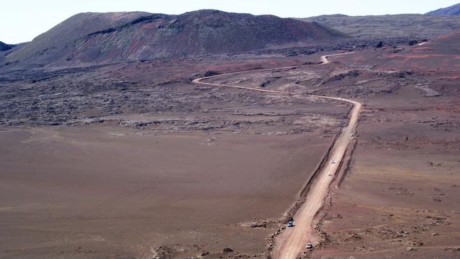 Reunion: a dusty road in a desolate landscape.