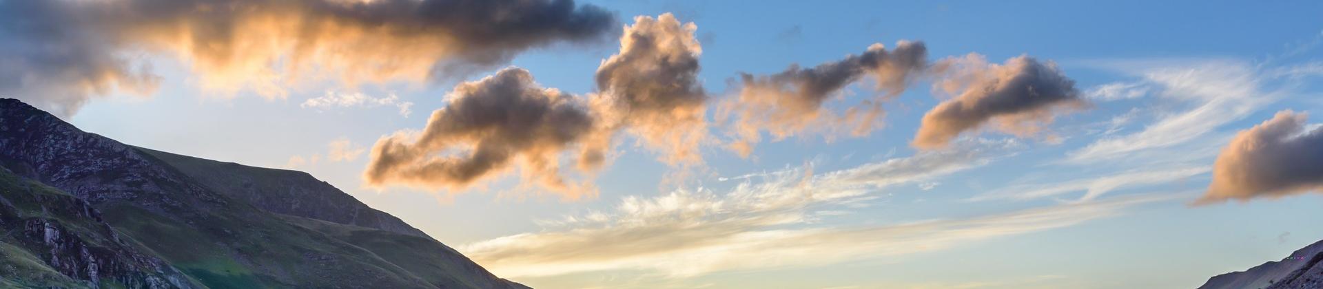 Aerial view of mountain range in Snowdonia at sunset time