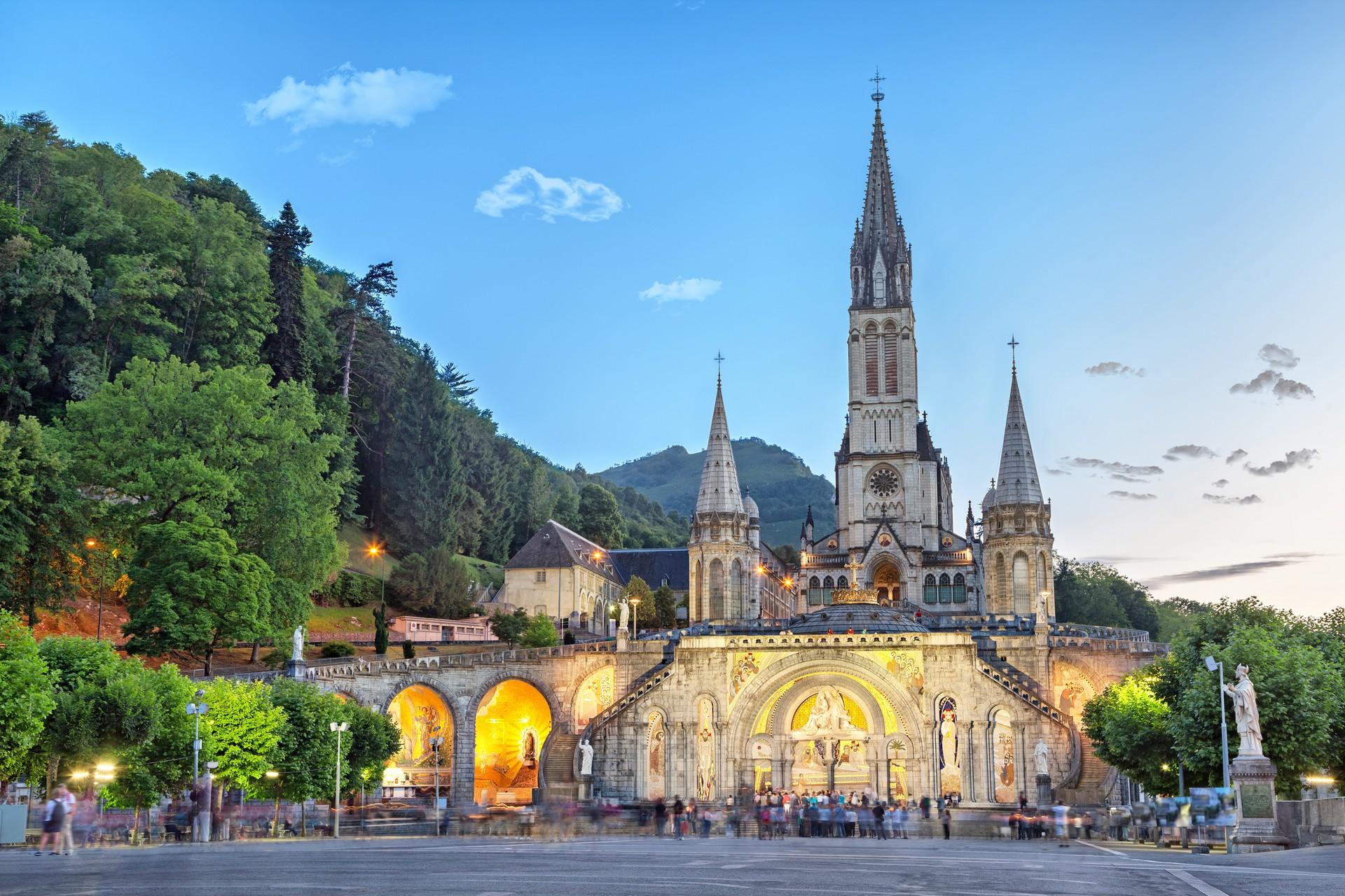 City square in Lourdes in sunny weather with few clouds