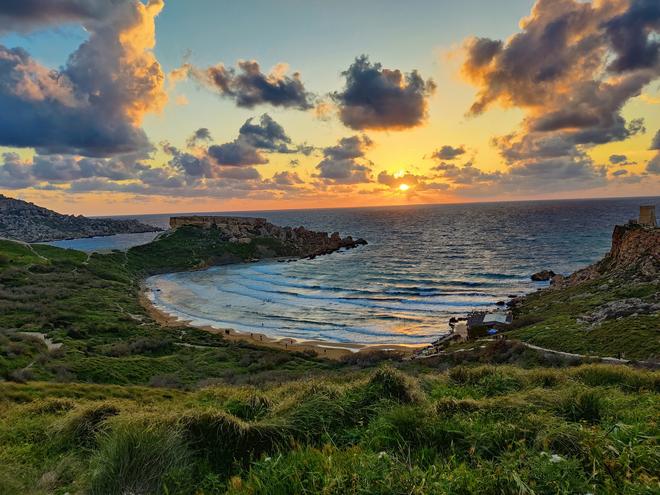 Riviera Bay, Malta: beach from above at sunset.