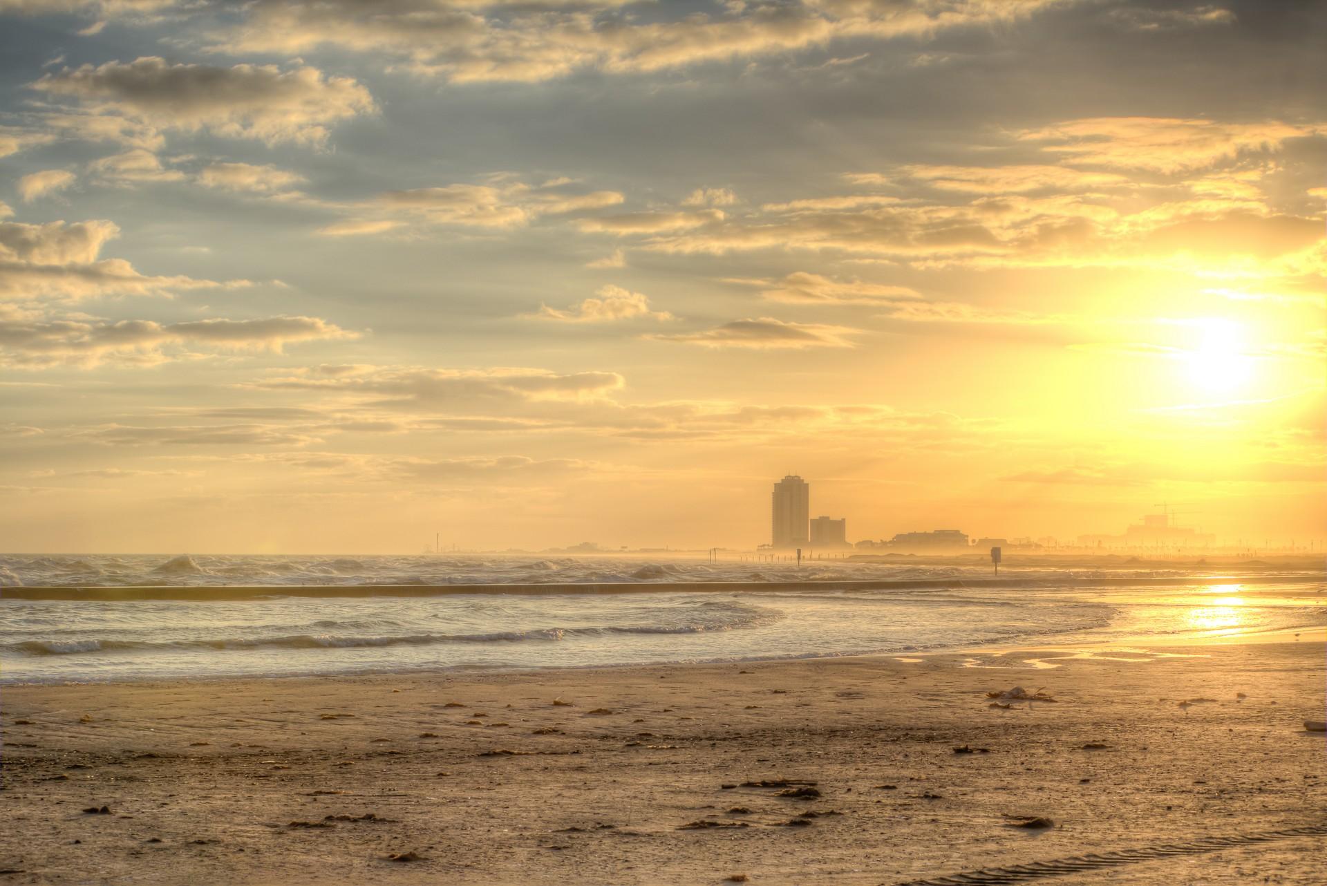 Beach and countryside in Galveston at sunset time
