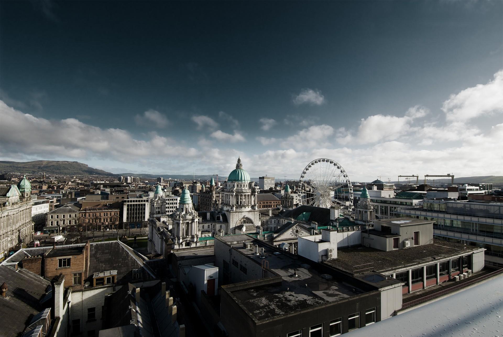 Aerial view of architecture in Belfast in sunny weather with few clouds