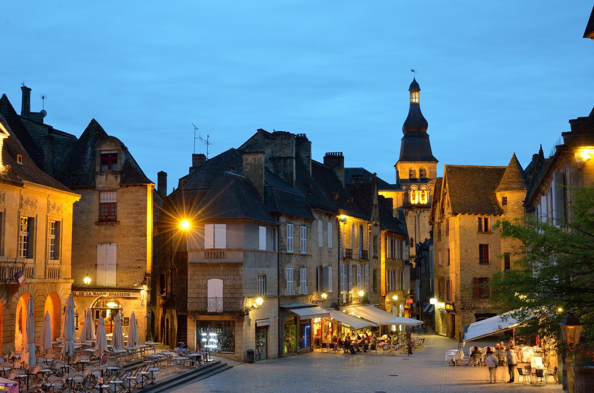 City square in Sarlat-la-Canéda at sunset time