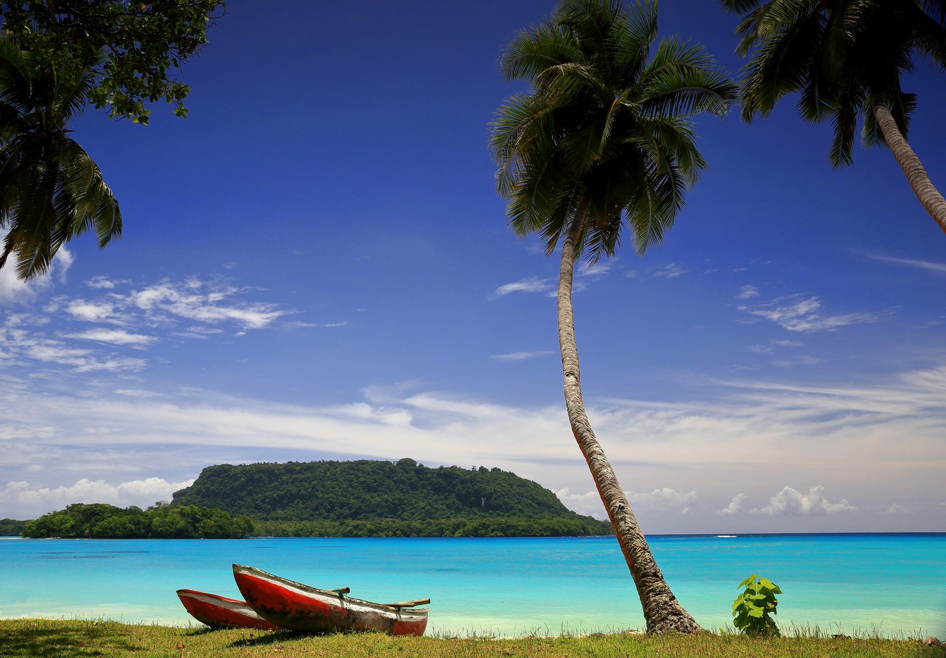 Boat near Luganville in sunny weather with few clouds