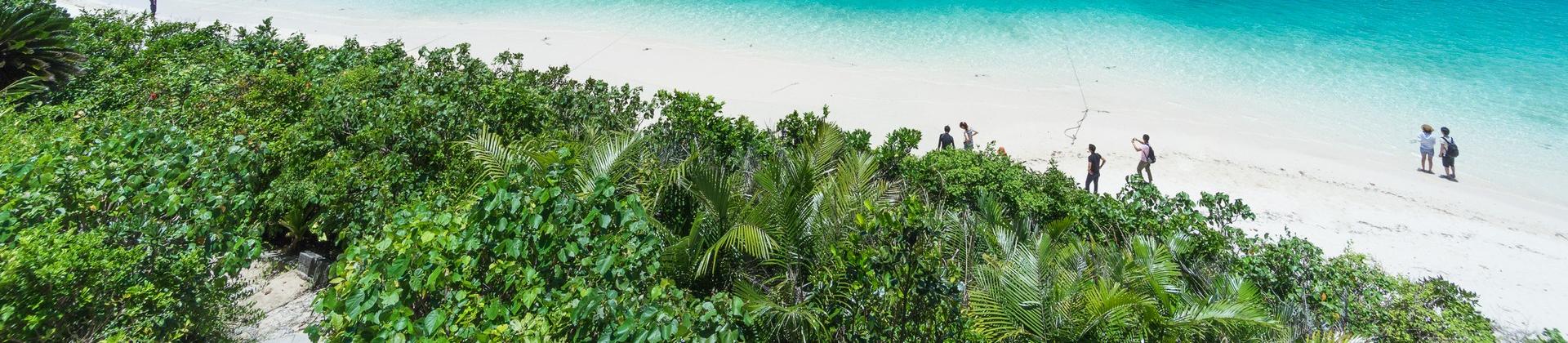Beach with turquise water in Ishigaki in sunny weather with few clouds