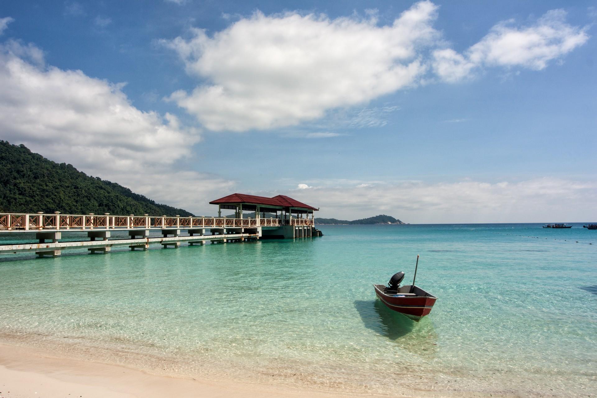 Beach with turquise water in Perhentian Islands in sunny weather with few clouds